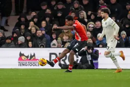 Reuell Walters clears the ball upfield