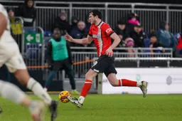 Tom Holmes advances with the ball