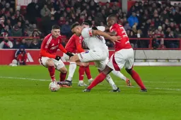 Carlton Morris is manhandled