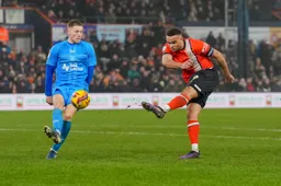 Carlton Morris blasts in a shot