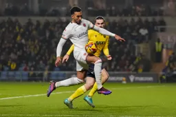 Jacob Brown controls the ball