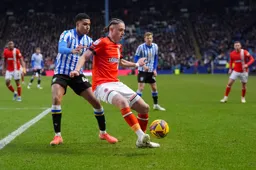 Thelo Aasgaard shields the ball