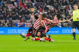 Carlton Morris battles through