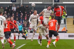 Teden Mengi is first to the ball