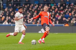 Kal Naismith slips the ball inside