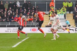 Elijah Adebayo attempts to bring the ball down