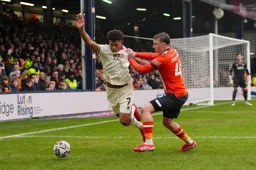 Alfie Doughty manhandles a Blades defender