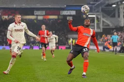 Millenic Alli keeps his eyes on the ball