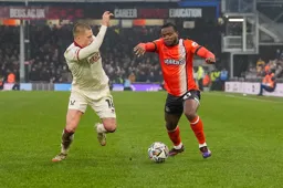 Millenic Alli tries to beat his man