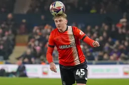 Alfie Doughty looks to be balancing the ball on his head