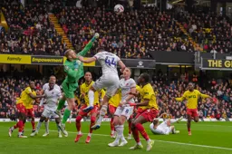 Lasse Nordas challenges the Watford goalkeeper