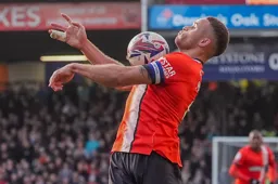 Carlton Morris cushions the ball