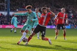 Carlton Morris tussles for the ball