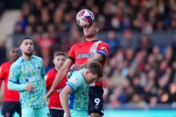 Carlton Morris wins his header