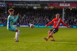 Alfie Doughty swings in a cross