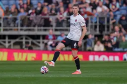 Mark McGuinness puts his foot on the ball