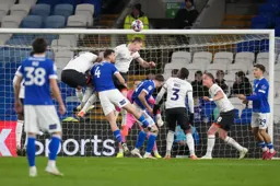 The Luton players attack the ball
