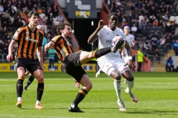 Elijah Adebayo tries to charge the ball down