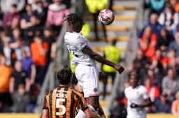 Elijah Adebayo with a text book header