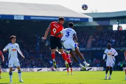 Carlton Morris heads forward