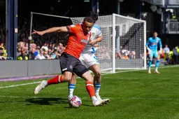 Carlton Morris tries to get in the box