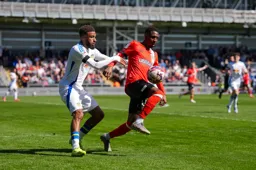 Isaiah Jones controls the ball