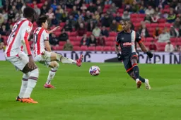 Amari'i Bell clips the ball forward