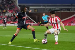 Tahith Chong in a battle for the ball