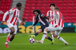 Tahith Chong is surrounded