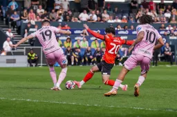 Liam Walsh attempts to win the ball