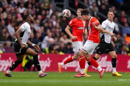 Kal Naismith gets to the ball first