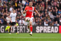 Carlton Morris chases after the ball