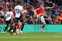 Mark McGuinness clears the danger