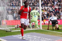 Millenic Alli wheels away after scoring