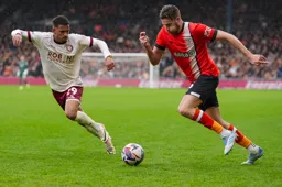 Reece Burke forces his way through