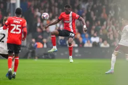Christ Makosso controls the ball in mid-air