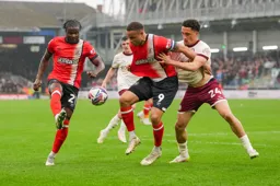 Town attempt to bundle the ball through