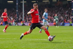 Jordan Clark controls the ball
