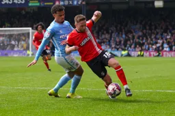 Jordan Clark skips past the defender