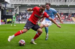 Carlton Morris shields the ball