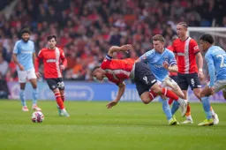 Carlton Morris takes a tumble