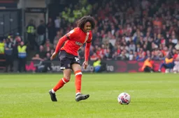 Tahith Chong plays the ball forward