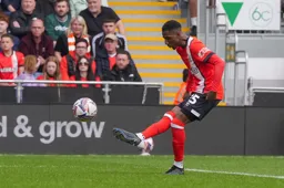 Isaah Jones plays the ball forwards
