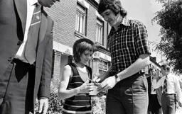 Adrian Alston Signs an Autograph