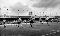 Dennis Wilshaw threatens the Town goal as Reg Pearce attempts to stop him