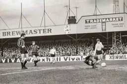 Malcolm Macdonald seems about to tap in.