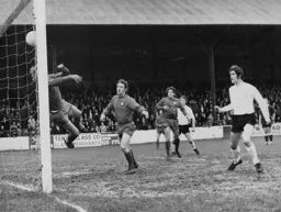 Don Givens sees his header clawed away