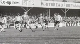 Roger Hoy slips the ball forward