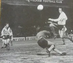 John Aston vaults over the goalkeeper