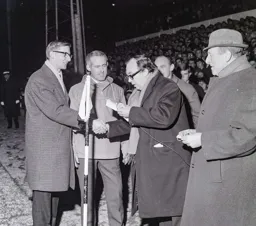 Eric Morecambe on prize giving duties with Len Hawkins